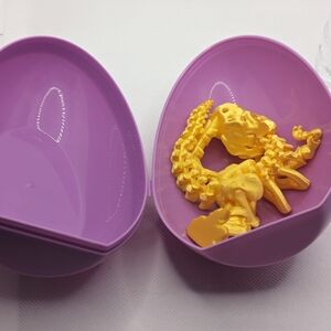 Purple Egg with Yellow Dinosaur Toy